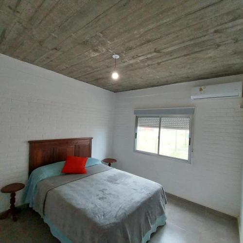 Ένα ή περισσότερα κρεβάτια σε δωμάτιο στο Casa 3 dormitorios frente al mar