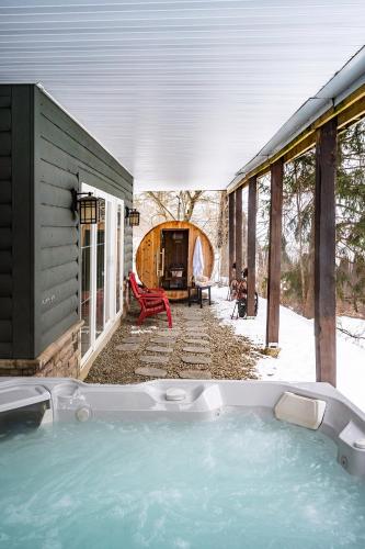 a hot tub in the backyard of a house at Gorgeous 5 Bdr with Hot Tub - Walk to Holi-Mont! in Ellicottville