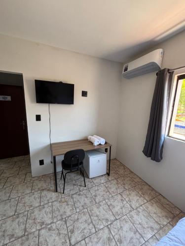 TV a/nebo společenská místnost v ubytování Périco Hotel