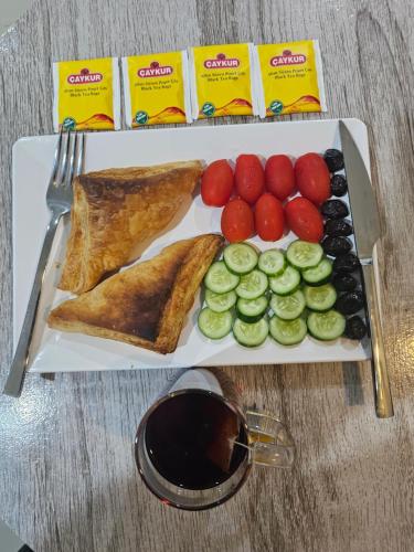 a tray with a plate of food on a table at 07 Antalya Boutique Hotel in Patong Beach