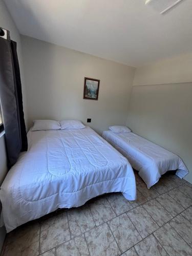 Postel nebo postele na pokoji v ubytování Périco Hotel