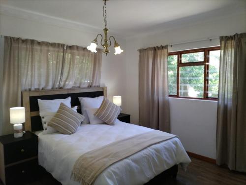 Postel nebo postele na pokoji v ubytování The Garden House