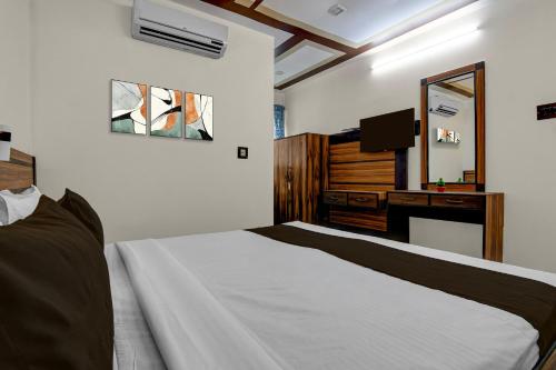 Ένα ή περισσότερα κρεβάτια σε δωμάτιο στο Hotel O Galaxy Inn