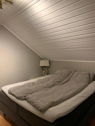 Postel nebo postele na pokoji v ubytování Tromsø - seksjonert hus i nydelige omgivelser