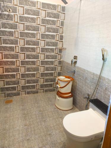 Ένα μπάνιο στο Tiger Home Stay Resort