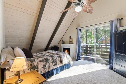 a bedroom with a bed and a fireplace at Boss's Cabin - Boss-level views, zero stress! in Shaver Lake