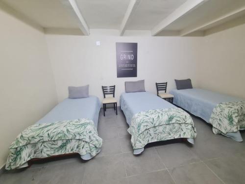 Una cama o camas en una habitación de Hostal Casa Gavilán