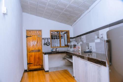 Kuchyň nebo kuchyňský kout v ubytování Good Home Mirissa