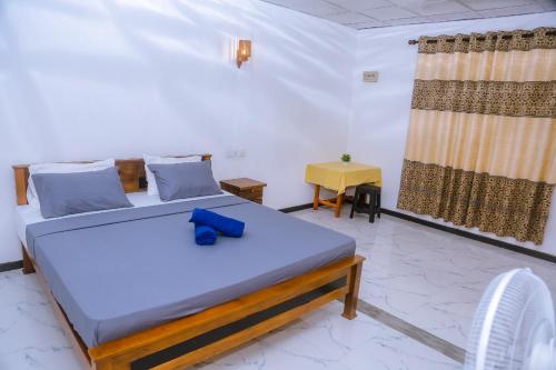 Postel nebo postele na pokoji v ubytování Good Home Mirissa