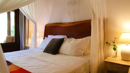 En eller flere senge i et værelse på Casa Cacau, Trancoso, ao lado do Quadrado