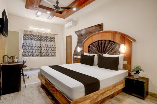 Ένα ή περισσότερα κρεβάτια σε δωμάτιο στο Townhouse Oak Tirupati Formerly Sky Towers