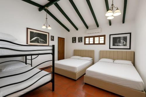 Postel nebo postele na pokoji v ubytování Casa Paula Acosta