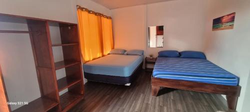 Ένα ή περισσότερα κρεβάτια σε δωμάτιο στο Villas murillo