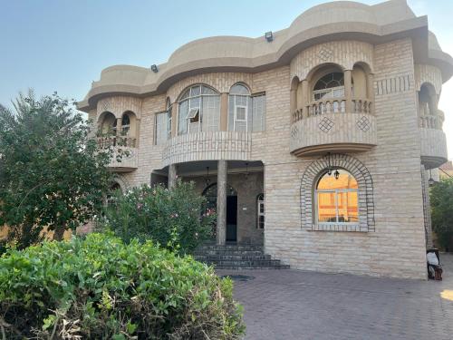 a large building with a balcony on top of it at doge villa 3 in Dubai