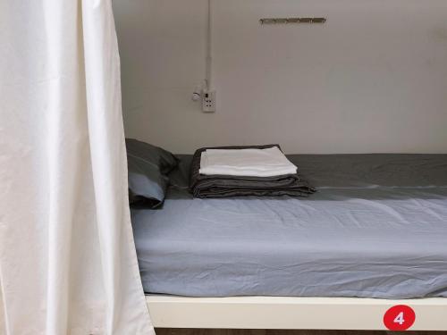 Postel nebo postele na pokoji v ubytování Bandlive Backpacker Hostel