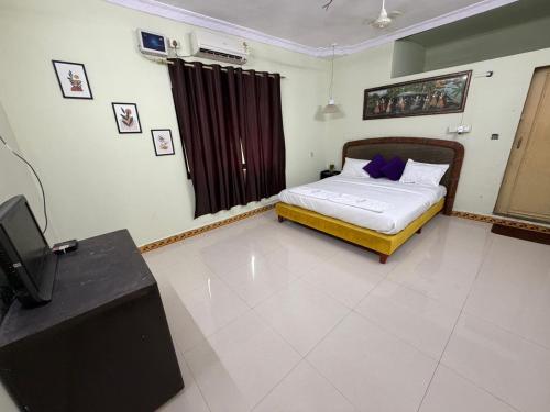 Un ou plusieurs lits dans un hébergement de l'établissement Green Waves Resort