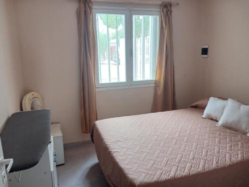 Ένα ή περισσότερα κρεβάτια σε δωμάτιο στο Cómoda y tranquila