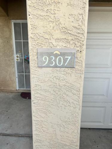 a house number on the side of a building at West Phoenix Value Room 4 Bennet in Phoenix