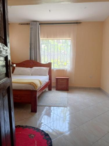 Ένα ή περισσότερα κρεβάτια σε δωμάτιο στο Ole supat Diani luxury villas