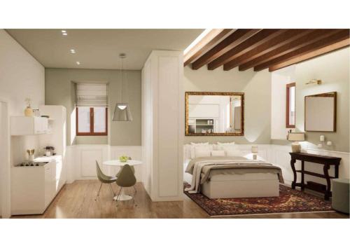 a bedroom with a bed and a sink and a mirror at Residenza Duomo3 - Apartments in Verona