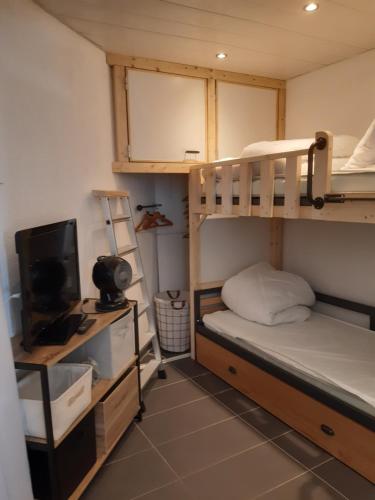 Ένα ή περισσότερα κρεβάτια σε δωμάτιο στο Nouveau, studio Port de Carnon 4 personnes