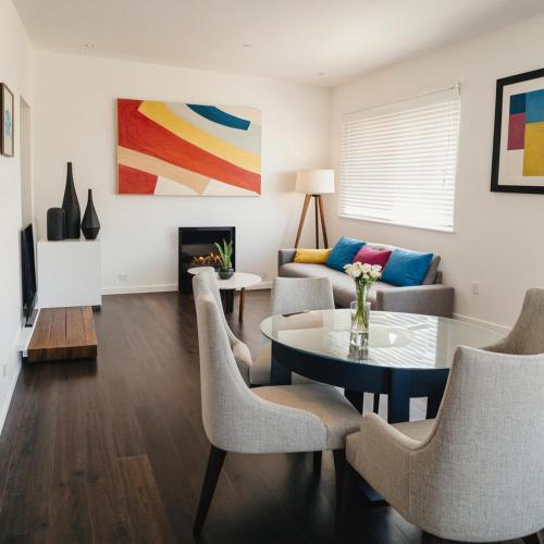 a living room with a table and chairs at Modern Venice Beach Stay - Walk to Marina & Boardwalk in Los Angeles
