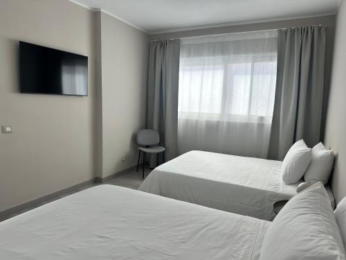 Postel nebo postele na pokoji v ubytování Cream apartamento, Las Galletas