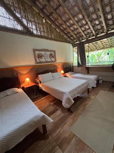 En eller flere senge i et værelse på CASA DE VIDRO