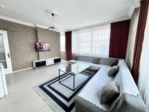 a living room with a couch and a glass table at 216 Blue Life in Istanbul