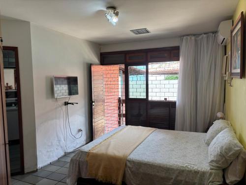 En eller flere senge i et værelse på Casa Beira Mar