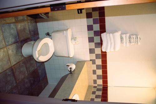 a bathroom with a urinal and a sink at Americas Best Value Inn-Fredonia in Fredonia