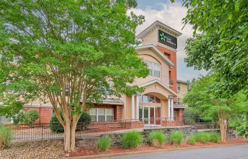 a building with a clock on the side of it at Extended Stay America Suites - Atlanta - Alpharetta - Northpoint - West in Alpharetta