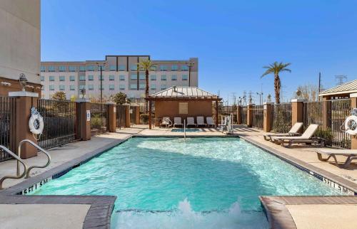 a swimming pool with a gazebo and a building at Extended Stay America Suites - Houston - IAH Airport in Houston