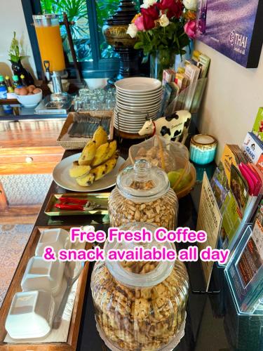 a table with a tray of fresh coffee and aasy available sidx sidx at Wualai Sabaidee in Chiang Mai