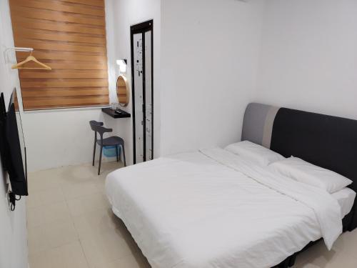 Ένα ή περισσότερα κρεβάτια σε δωμάτιο στο YNY Guest House