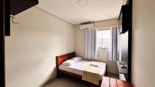 Postel nebo postele na pokoji v ubytování Piritiba Hotel