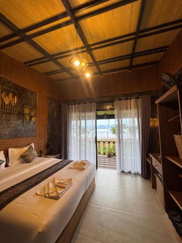 Postel nebo postele na pokoji v ubytování Baan Rattana