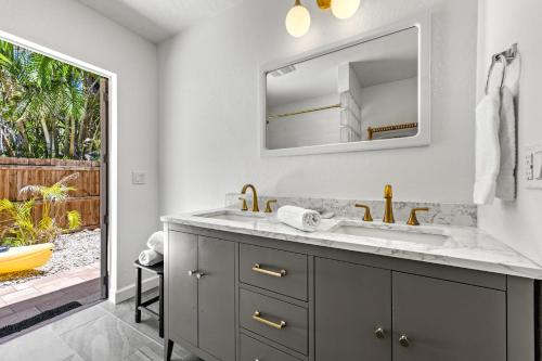a bathroom with a sink and a mirror at Siesta Dolce - 3750 in Siesta Key
