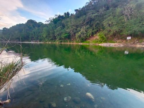 a view of a river with mountains in the background at Juan's Mountaintop Lodge in Laiban
