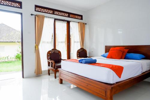 Ένα ή περισσότερα κρεβάτια σε δωμάτιο στο Hotel Segara Kedisan Kintamani