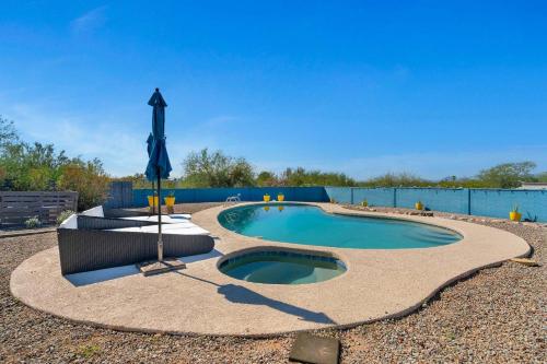 a small swimming pool in a gravel yard at New Sonoran Oasis pool hot Tub Sleeps 12 in Tucson