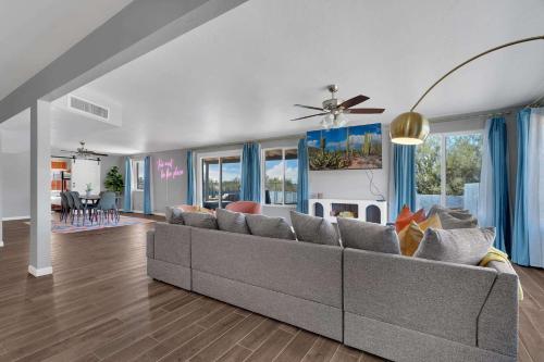 a living room with a couch and a dining room at New Sonoran Oasis pool hot Tub Sleeps 12 in Tucson