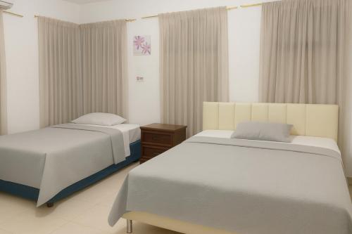 Llit o llits en una habitació de Veranera Hostal