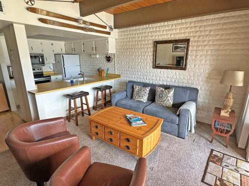 a living room with a couch and a table at 439 Ala Wai, 119 condo in Lake Valley