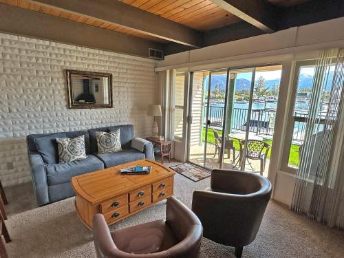 a living room with a couch and chairs and a table at 439 Ala Wai, 119 condo in Lake Valley