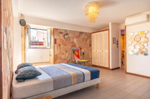 Ένα ή περισσότερα κρεβάτια σε δωμάτιο στο Ti-kaz