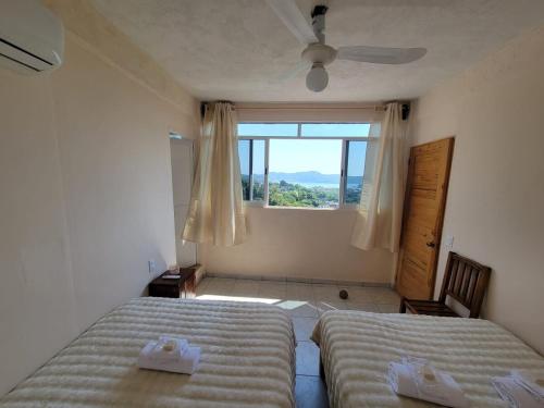 Postel nebo postele na pokoji v ubytování Acogedor departamento con vista al mar