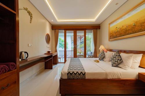 Ένα ή περισσότερα κρεβάτια σε δωμάτιο στο Narada House Ubud