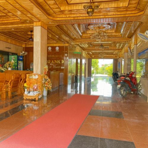 a hallway with a red carpet in a building at Phương Anh 9 Hotel- Only accept Vietnamese customers in Danang