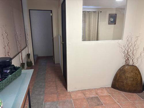 Телевизор и/или развлекательный центр в 1 Centrico y lujoso apartamento en Atlíxco